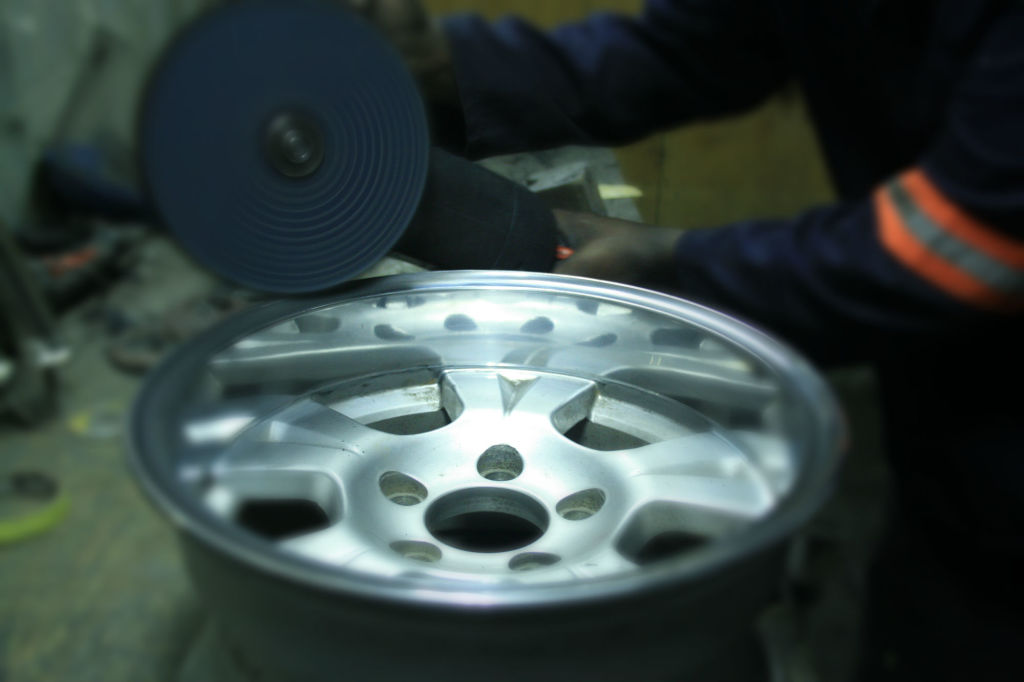 A rim being polished at Holland Metal Products